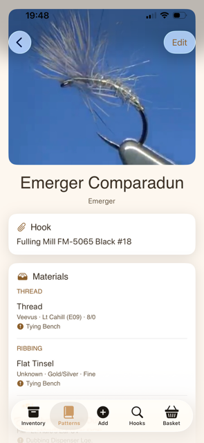 Pattern detail showing an Emerger Comparadun with hook and materials